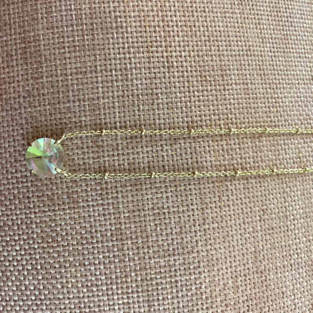 Gold “unicorn” stone necklace